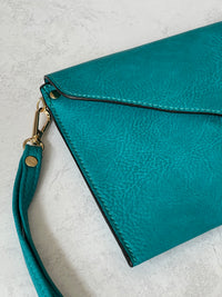 TURQUOISE OVER-SIZED ENVELOPE CLUTCH BAG WITH LONG CROSS BODY AND WRISTLET STRAP