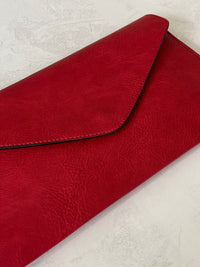 DEEP RED OVER-SIZED ENVELOPE CLUTCH BAG WITH LONG CROSS BODY AND WRISTLET STRAP