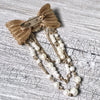 A-SHU VINTAGE GOLD METAL DIAMANTE BOW BROOCH PIN WITH PEARL CHAIN - A-SHU.CO.UK